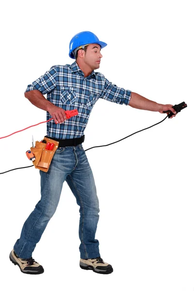 A handyman with power clamps. — Stock Photo, Image