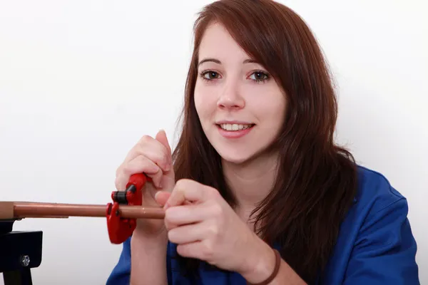 Portrait of a young woman plumbing — Stock Photo, Image