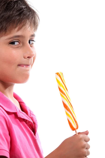Pojke med jätte lollipop — Stockfoto