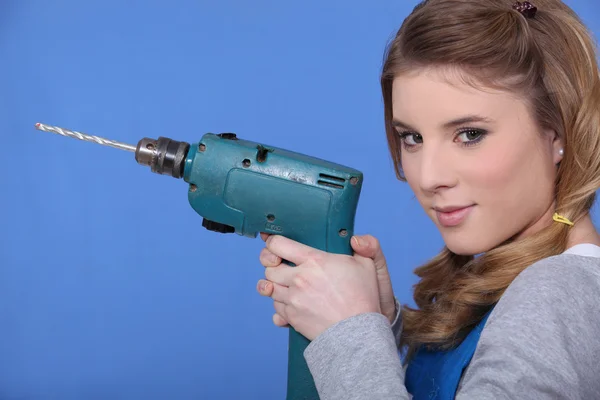 Woman holding power drill — Stock Photo, Image