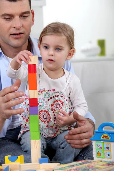 Father and daughter with building blocks — Stock Photo, Image