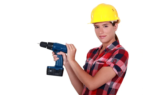 Handwerkerin hält ein Elektrowerkzeug in der Hand — Stockfoto