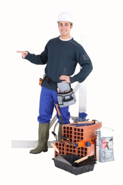 Bricklayer pointing to empty copyspace clipart