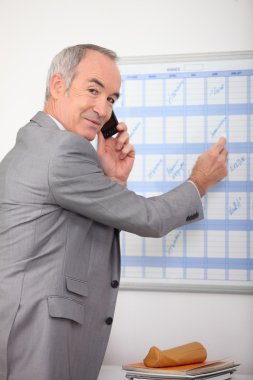 Businessman making a call clipart