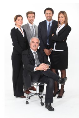 Young business team standing behind their boss clipart