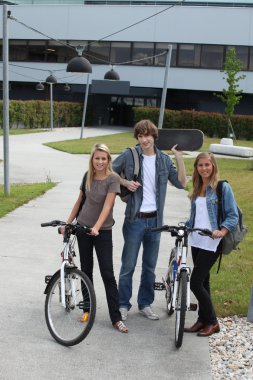 Young with bicycles and skateboard clipart