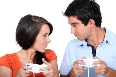 Two young playing computer games clipart