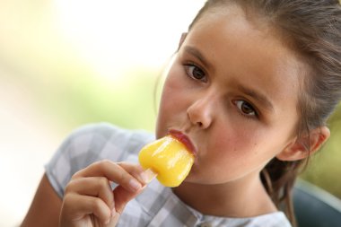 Little girl with ice lolly clipart