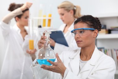 Women working in a laboratory clipart