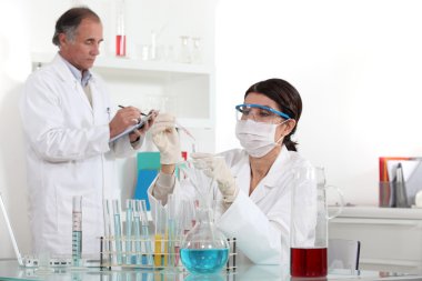 Two scientists working in laboratory clipart