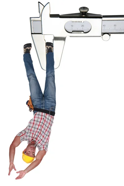 Montagem de um trabalhador preso em um callipers — Fotografia de Stock
