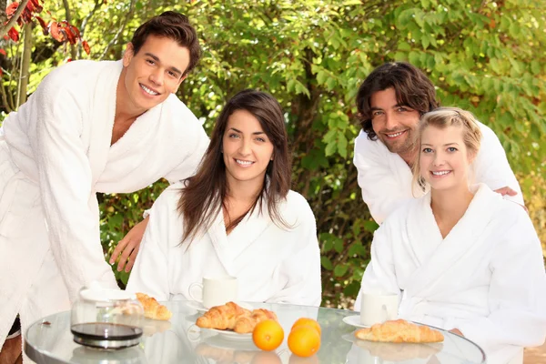 Two couples sharing breakfast — Stock Photo, Image