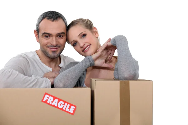 Couple stood with storage boxes — Stock Photo, Image