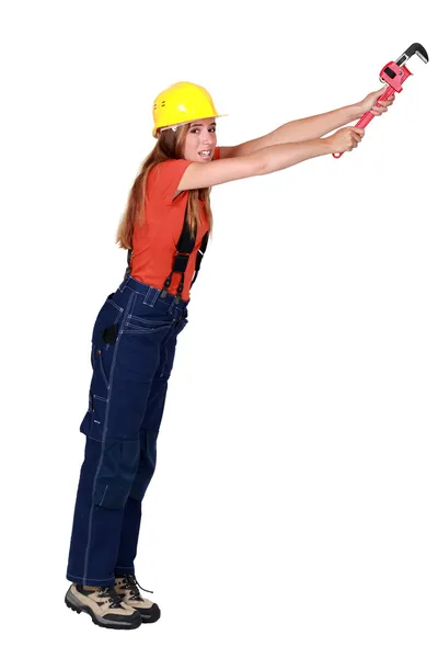 Tradeswoman hanging on for dear life — Stock Photo, Image