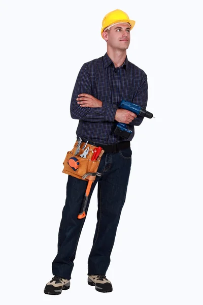 Construtor confiante segurando broca — Fotografia de Stock