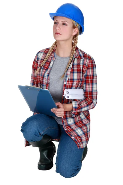 Female construction worker with a clipboard — Stock Photo, Image