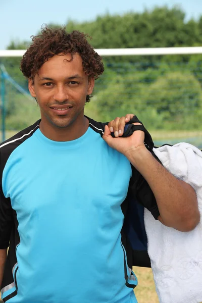 Football player with bag — Stock Photo, Image