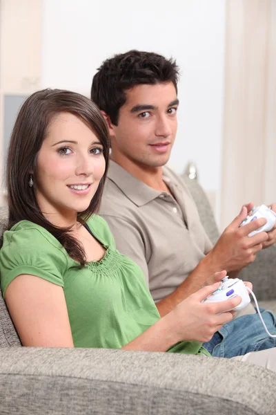 Young playing video games — Stock Photo, Image