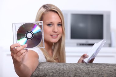 Girl listening to CDs clipart