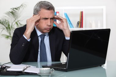 Man stressed with a laptop clipart