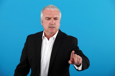 Stern businessman pointing clipart