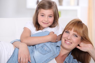 Mother and daughter at home clipart