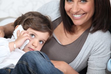 Woman spending time with her child clipart