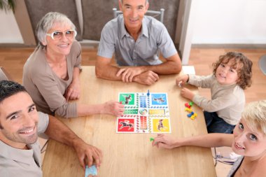 Family playing board games. clipart