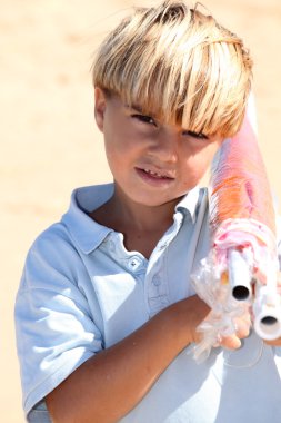 Boy carrying parasol clipart