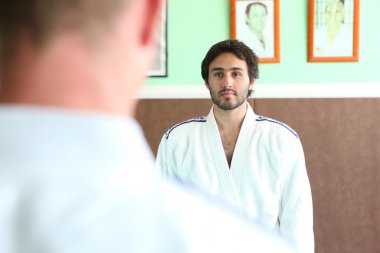 Men preparing for a b out of judo clipart