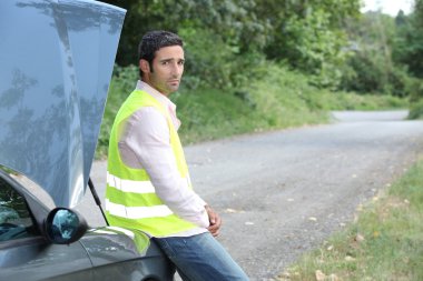 Man waiting for roadside assistance clipart