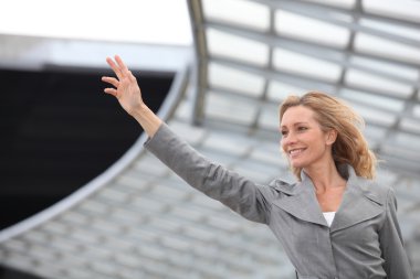 Businesswoman waving clipart