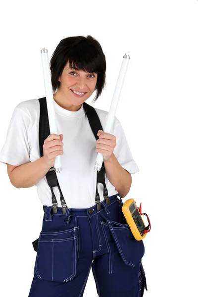 Female electrician with lightbulbs — Stock Photo, Image