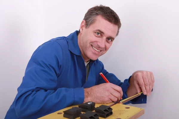 stock image Plumber marking copper pipe