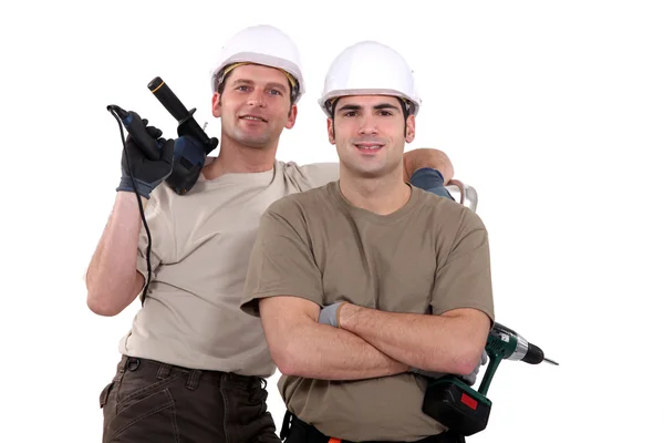 Dos trabajadores manuales con taladros — Foto de Stock