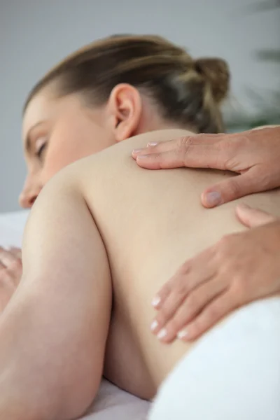 Woman having a back massage — Stok fotoğraf