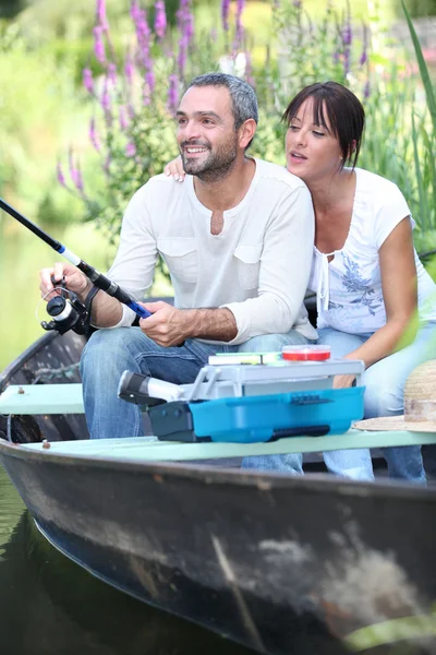 A couple fishing on a boat — Stok fotoğraf