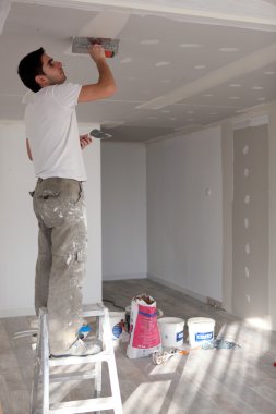 Craftsman painting the ceiling clipart