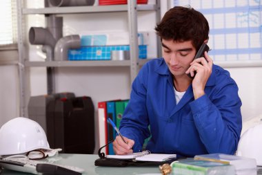 Construction worker arranging an appointment clipart