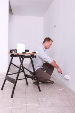 Man painting a wall clipart