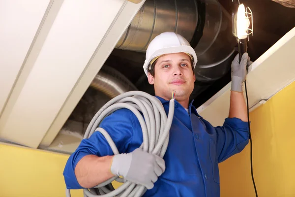 Plumber on a ladder — Stock Photo, Image