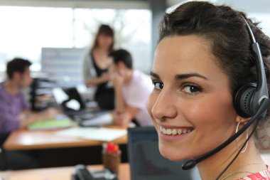 Woman wearing a telephone headset clipart