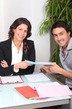 Businesspeople signing contract clipart