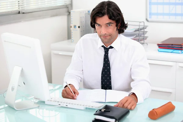 Man working at his desk — Stock Photo, Image