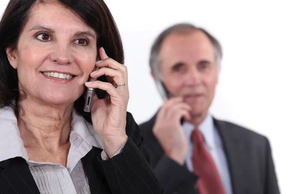 Mature couple on the phone — Stock Photo, Image