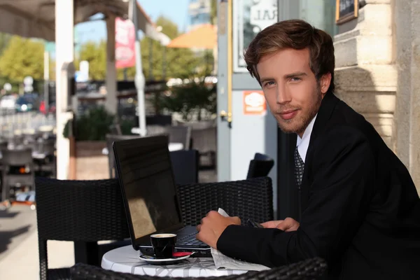 Young executive in a cafe — Stock Photo, Image