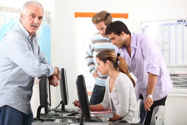 Manager and his team working at computers — Stock Photo, Image