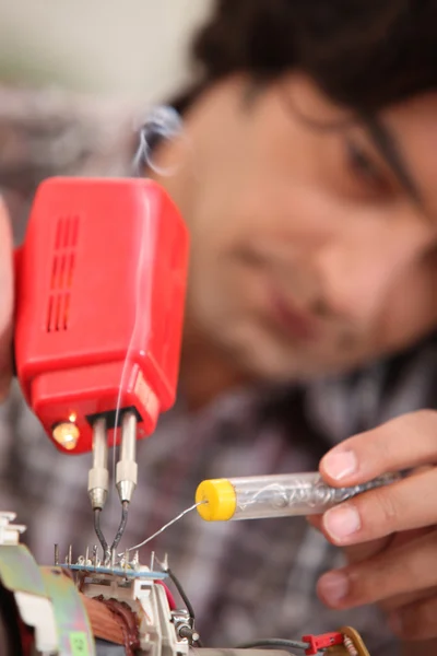 Man using soldering iron — Stock Photo, Image