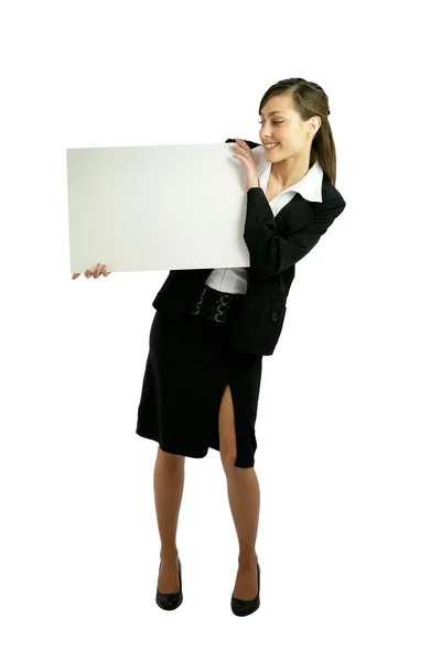 Женщина в костюме держит белую панель — стоковое фото