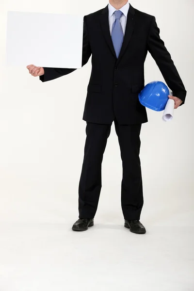 Architekt, drží prázdné plakát — Stock fotografie